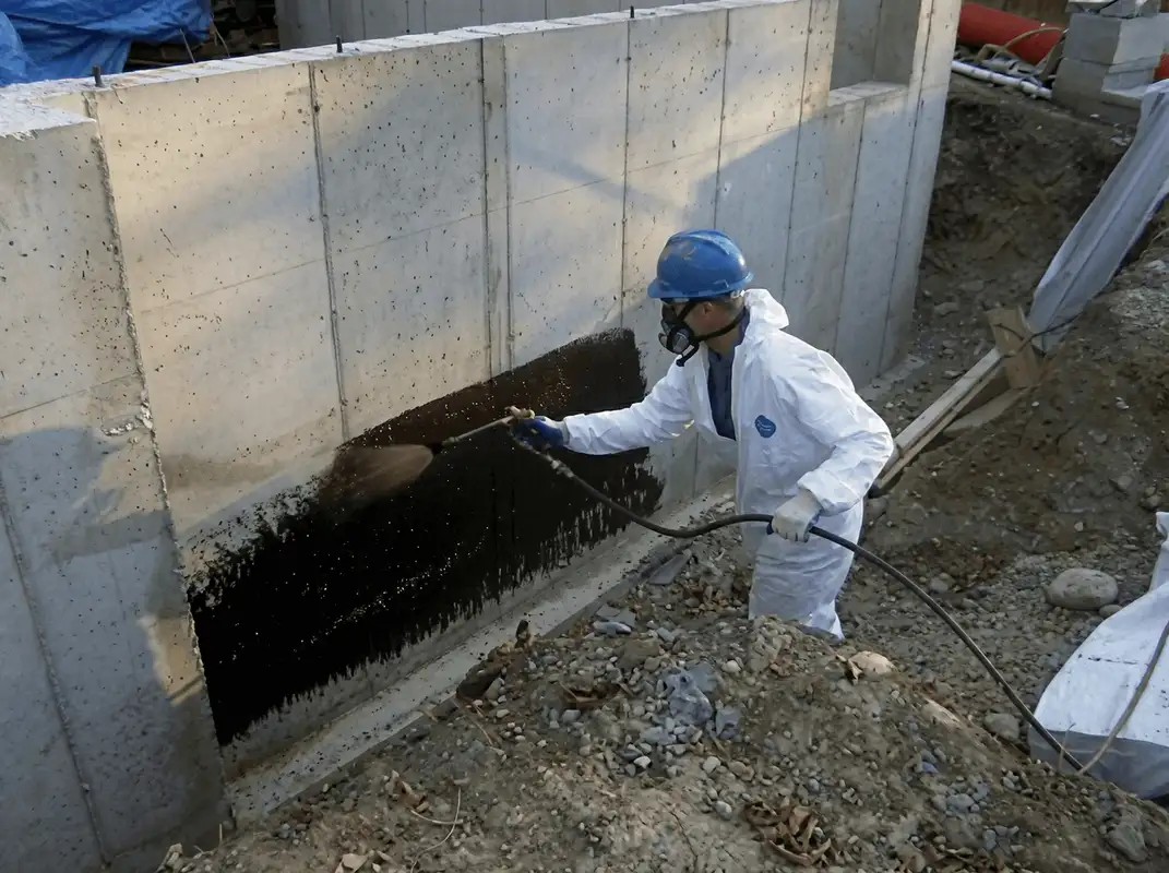 Professional waterproofing the exterior walls of the basement in Houston, TX