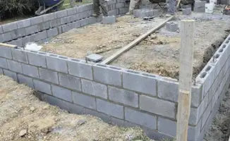 Professionals building a foundation with blocks in Houston, TX