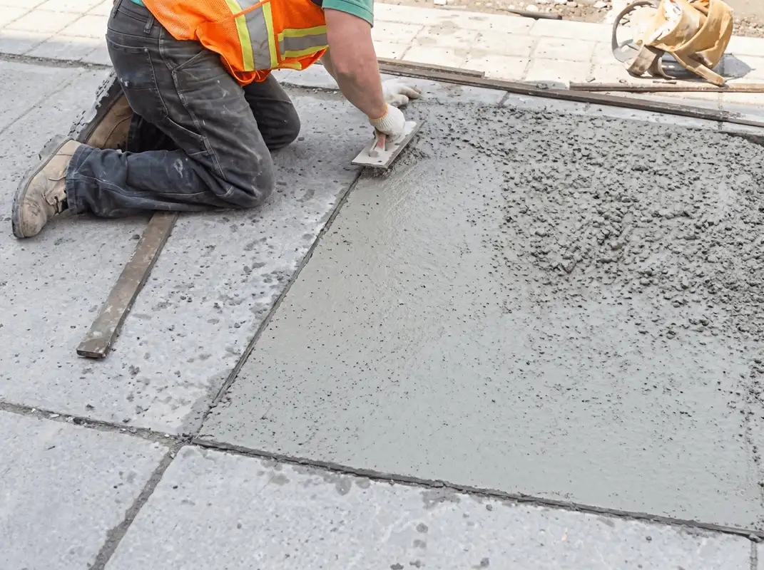 Professional repairing a concrete floor in Houston, TX