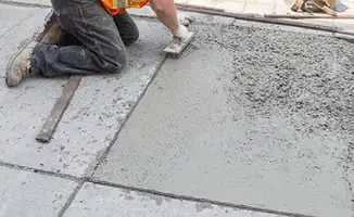 Professional repairing a concrete floor in Houston, TX