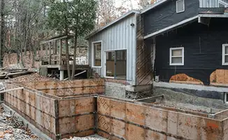 Prepared site with foundation forms for home remodeling and addition project in Houston, TX